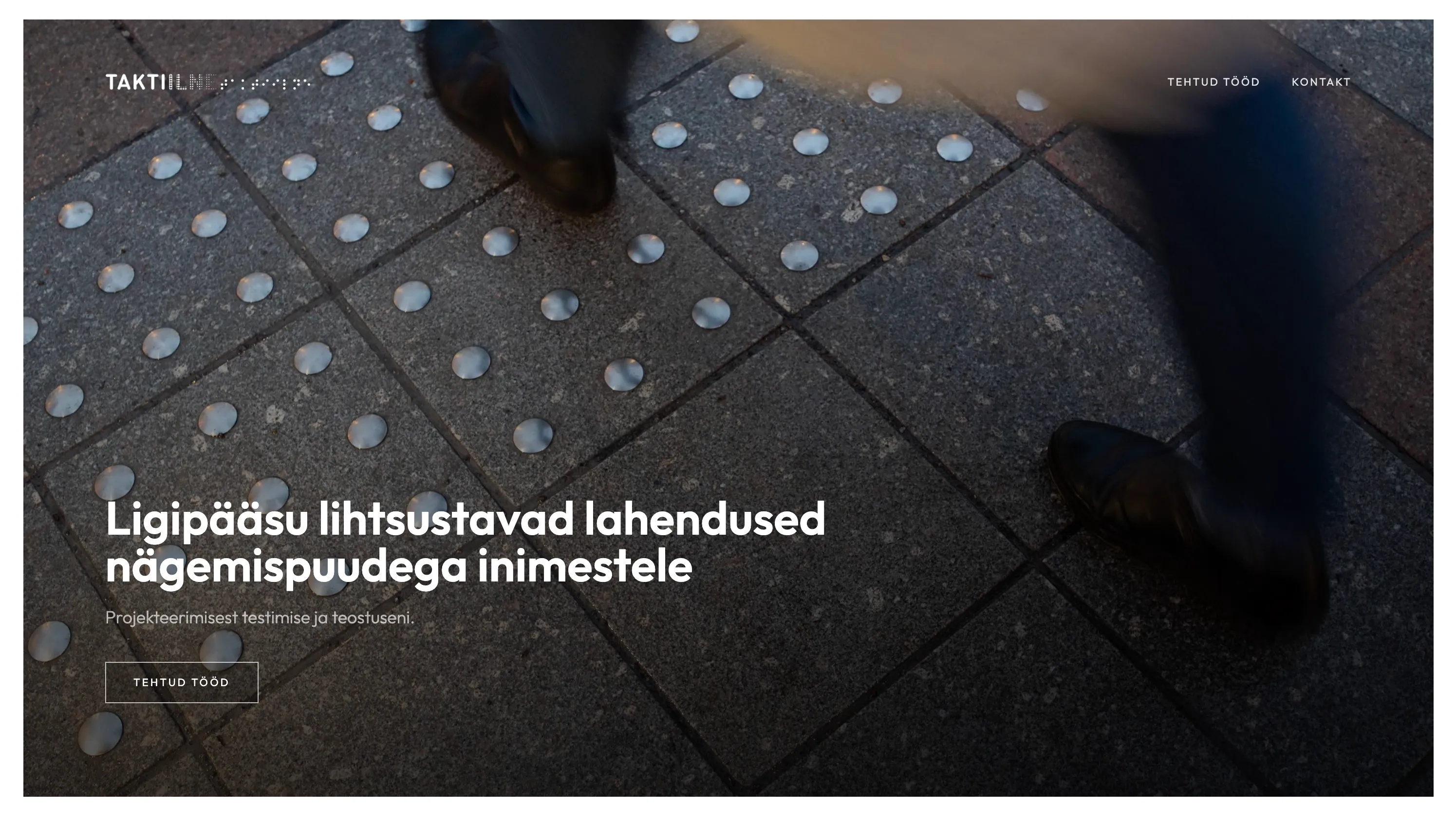 The taktiilne.ee homepage: a photograph of tactile paving underfoot with the headline set over it.